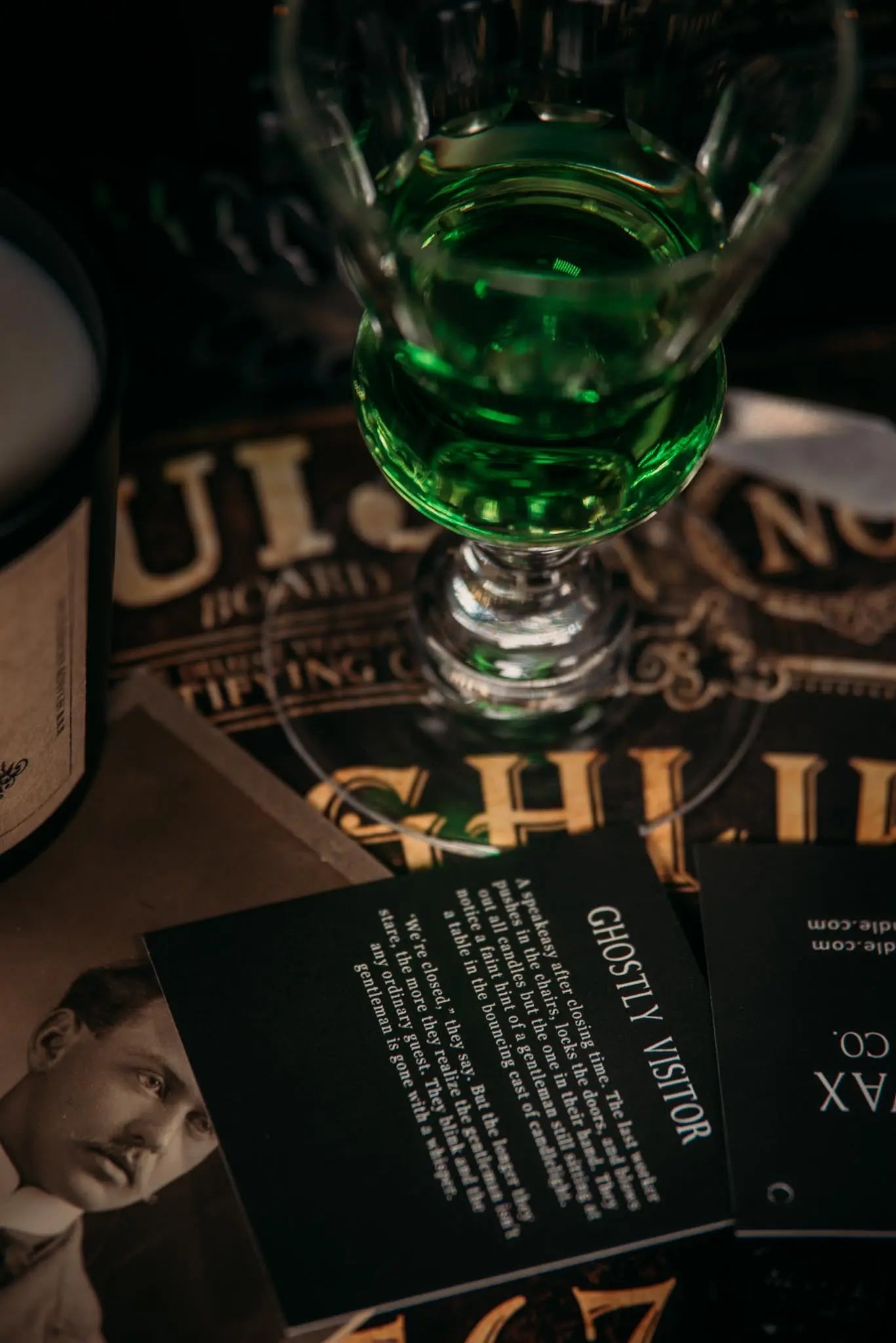 Ghostly Visitor story card sitting on a ouija board