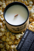 Load image into Gallery viewer, looking down into a creepy clown candle at a wooden wick