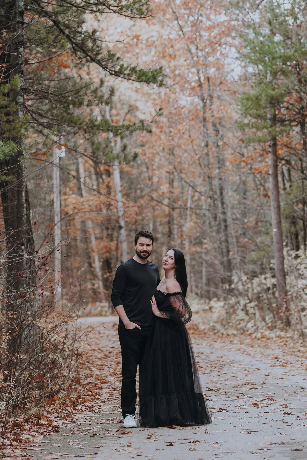 Meghan and Eric standing in the forest 