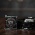 Load image into Gallery viewer, Sticker saying black sails on a bar of soap
