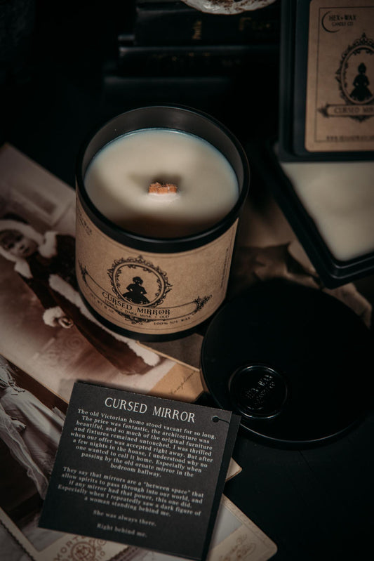 Cursed mirror candle as seen from above with a victorian child's picture underneath