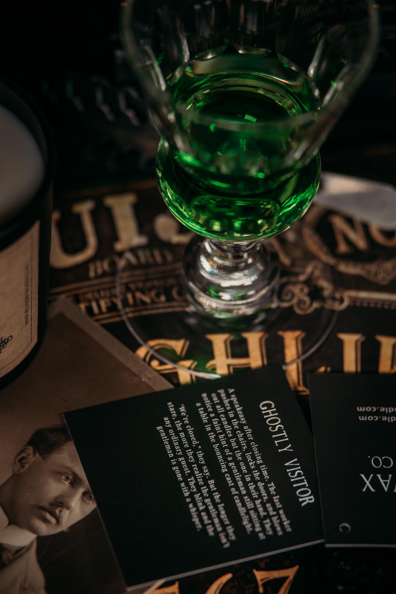 Ghostly Visitor story card sitting on a ouija board