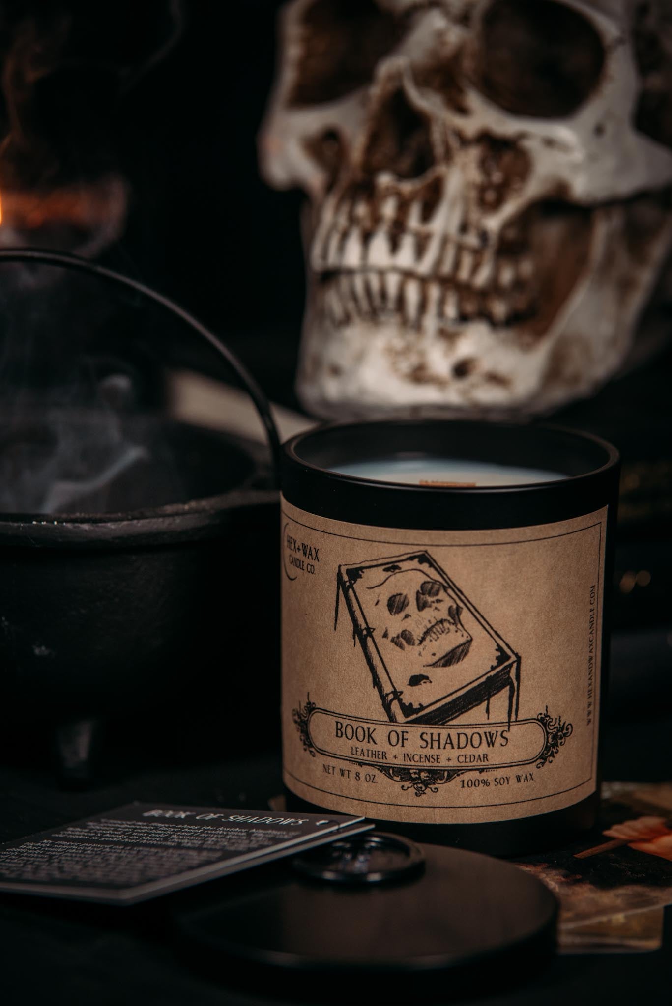 Book of shadows sitting next to incense 