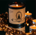 Load image into Gallery viewer, Cursed Mirror gothic candle surrounded by candlelight

