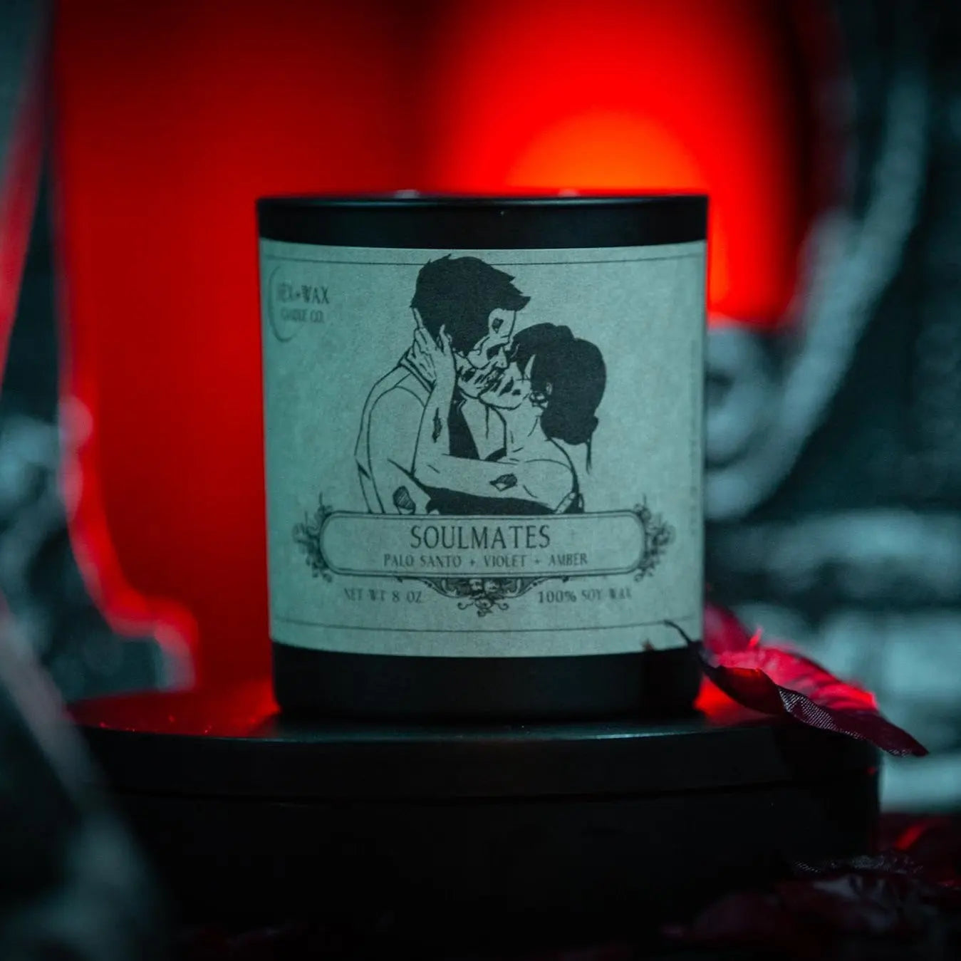 a candle showing two people kissing and they look like zombies